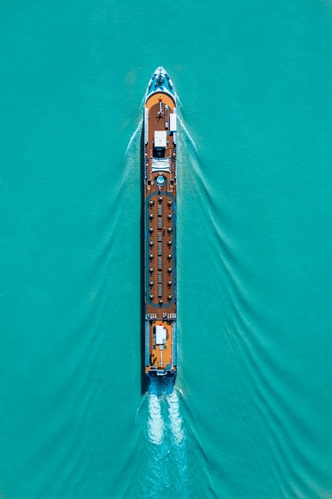 pexels photo 2634269 2634269 Drone shot of a cruise ship navigating turquoise waters, creating ripples and waves.